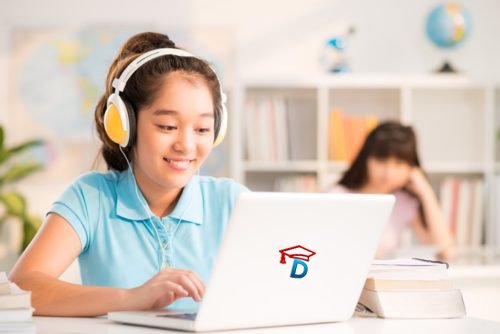 A Student using headphones to study on a laptop displaying the English lab software website and logo.